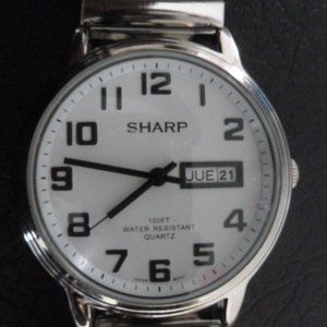 SHARP  WATCH  $18.00  KEEPS  TIME